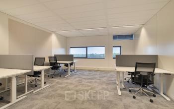 Modern office space rental at Zwartewaterallee 56 in Zwolle featuring sleek workstations and large windows offering natural light, ideal for productivity and collaboration.