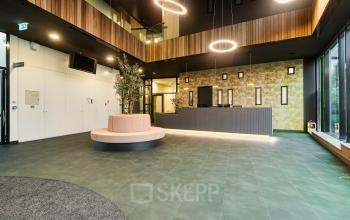 Spacious entrance with modern design at Zwartewaterallee 56, Zwolle, featuring a reception area ideal for office space rental.