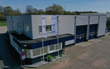 Exterior view of office space available for rent at Pascalweg 6, Zwolle, featuring a modern façade with large entrances.